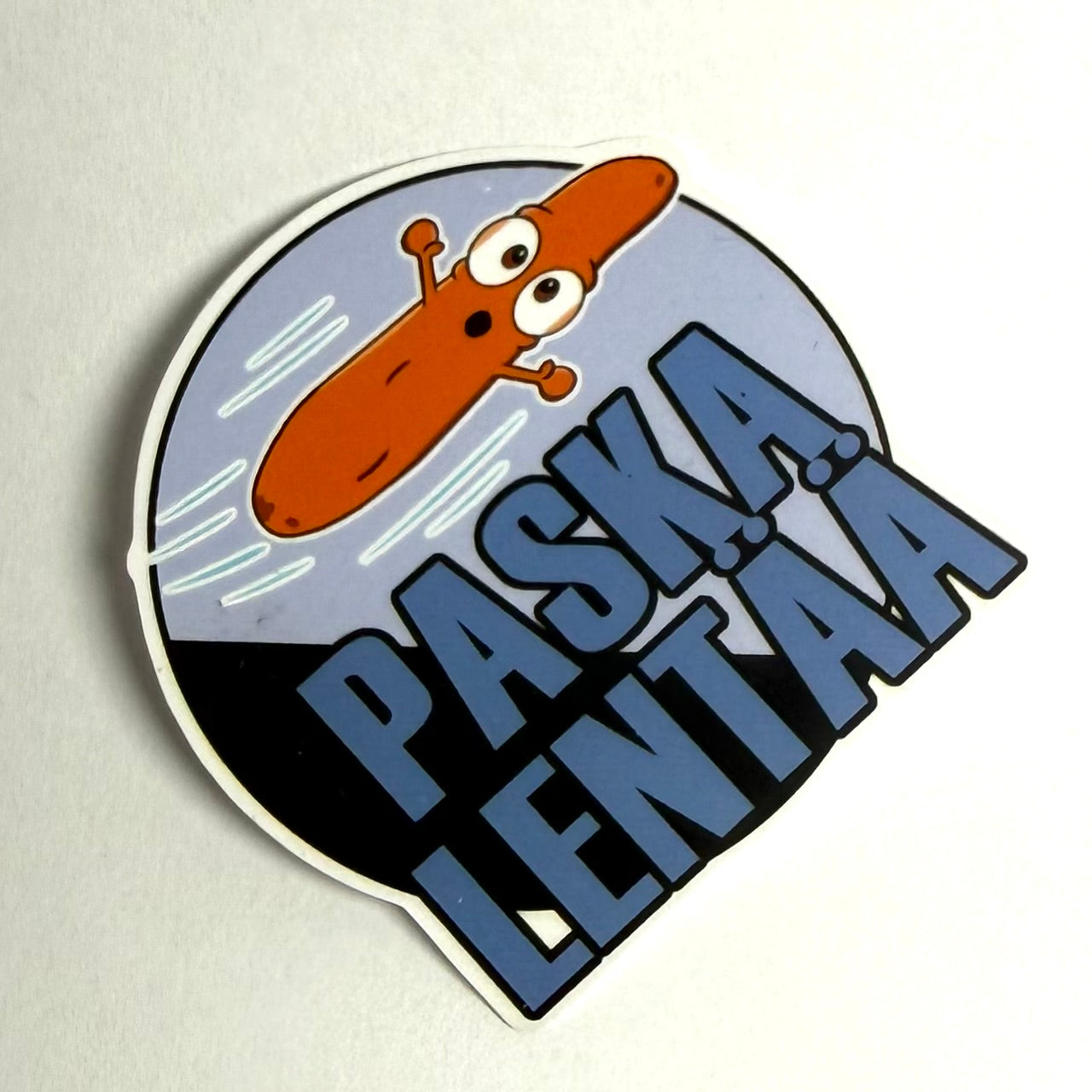 Paska lentää tarra